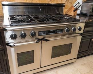 A Dacor Stainless Double Oven Six Burner Stove with Stainless Hood. Circa 2013-2014. No Serial Number Evident.
Condition: Good to Very Good with moderate wear.	$4,000.00
