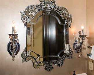 A Venetian Glass Mirror.  Circa 2000-2010.  Sconces Omitted.
The mirror of Italian origin in the Venetian taste.

Condition : Very Good with no fractures or chips.
Dimensions: Mirror Height 36 x width 24 ½ x depth 2 inches.   $250.00

							Mirror: 	$100.00-$250.00
						
