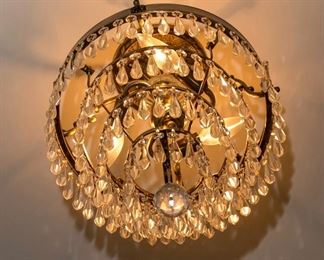 A Brass and Leaded Glass Diminutive Four Tier Chandelier. Circa 2010-2013.
Condition: Very Good.
Dimensions: Height 18 x width 14 inches approximately.    $250.00
