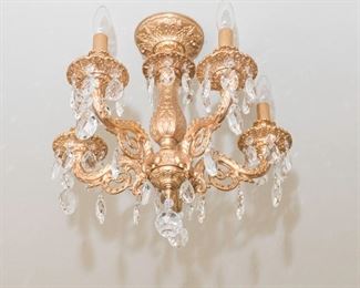 Two Yellow Metal and Leaded Glass Chandeliers. Circa 2010-2013.
The 2 chandeliers having 5 electrified candles.
Condition: Very Good.
Dimensions: Height 16 x width 16 inches approximately. For Two: $750.00