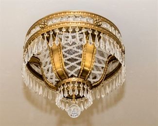 A Brushed Brass and Leaded Glass Diminutive Chandelier. Circa 2010-2013.
Condition: Very Good.
Dimensions: Height 18 x width 18 inches. $300.00
