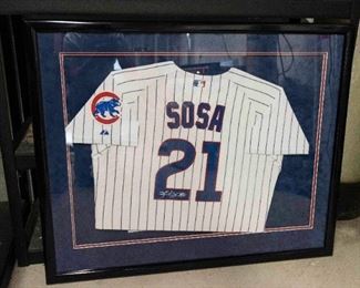A Framed and Signed Sammy Sosa Cubs Baseball Jersey. No Date.
Condition: Very Good.
Dimensions: Frame 34 ½ x 42 inches. $1,500.00