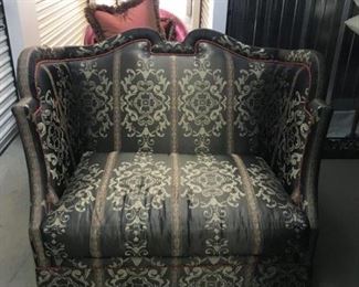 A Silk upholstered settee in a stylized Louis XV manner with serpentine crest rail above the silk back above the silk upholstered seat with matching skirt. Label marked Marge Carson
Height 39 x width 49 x depth 29 inches. $2,500.00