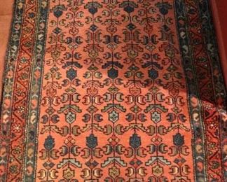 One of a Dozen Vintage and Antique Hand Knotted Rugs