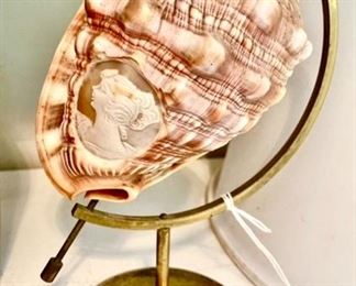 Vintage carved cameo conch shell on brass stand