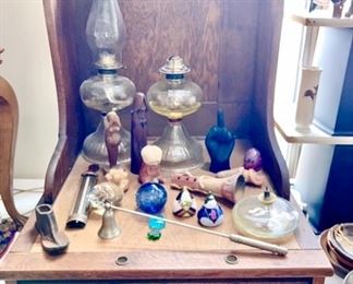 Antique desk top, kerosene lamps, art glass oil burners, candle snuffer, etc.