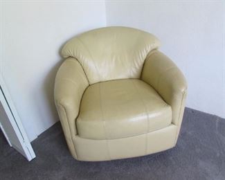 Yellow gold leather club chair, swivels and rocks