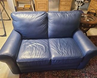 Blue leather love seat