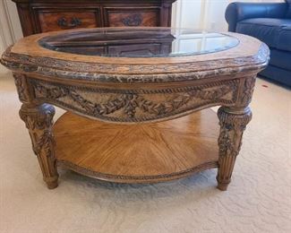 Intricate, carved, marble edged coffee table