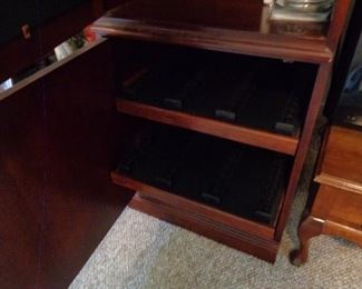 drawers in media cabinet to hold CDs and videos