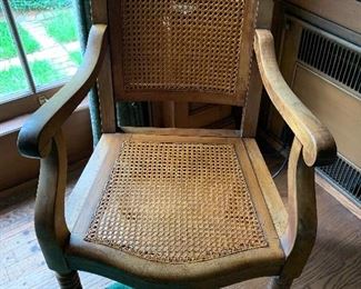 Unique adjustable back caned chair