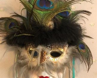 collection of porcelain and Mardi Gras type masks