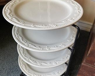 Four tier plate set on a rack. 
