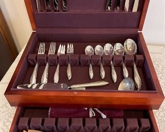 Sterling silver silverware set in silver storage box. 