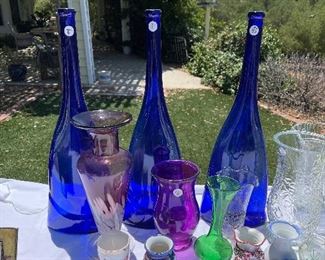Tall blue glass bottles.