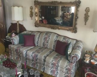 Floral Couch With A Beautiful Large Gold Mirror And Sconces