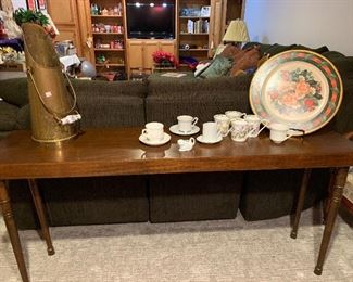 Sofa table, tea cups, copper decor