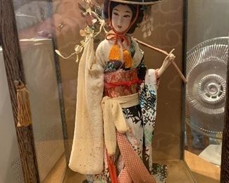 Japanese doll in glass case