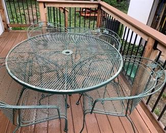 Wrought  round table and four chairs