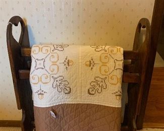 Beautiful hand quilted quilt and quilt rack