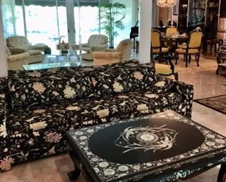 Asian, claw foot, black lacquered & inlaid MOP coffee table

Quilted floral sofa  