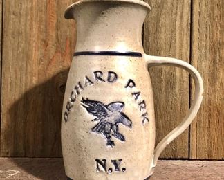 $35 Stoneware handled jug, inscribed “Orchard Park, NY” with bird. 8.75” H x 4.75” diameter
