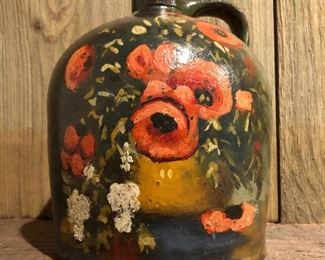 $50 Black stoneware jug with painted floral decoration.
7” H x 5.5” diameter
