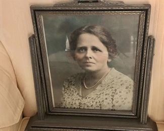 $65 Photo of solemn woman in antique tilting frame
13” H x 12.75” W
