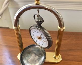 $120 - Waltham coin silver pocket watch on stand 