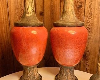 $125 AS IS  - Pair orange glazed covered stoneware urns AS IS. Cracked and reglued -  Each 21" H, 8" diam.