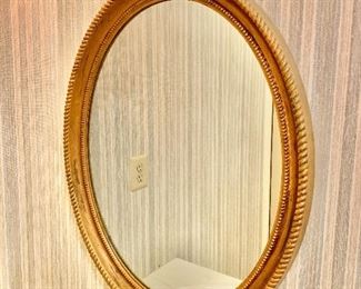 $50 - Oval wall mirror. 31" H, 24.75" W.