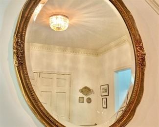 $250 - Oval gilded, beveled mirror.  31" H, 25" W. 