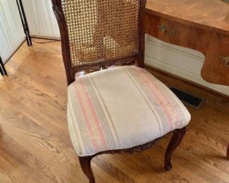 $95 - Cane-backed upholstered chair. 39" H, 20" W, 18.5" D, seat height 18.5".