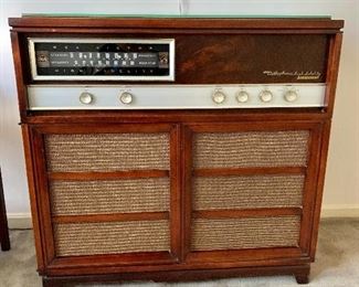 $250 - Radio cabinet as is (radio powers on but doesn't tune).  34" H, 35" W, 16.5" D. 