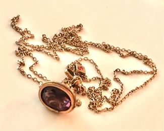 $60 Very vintage watch fob amethyst color stone.  55" L. 