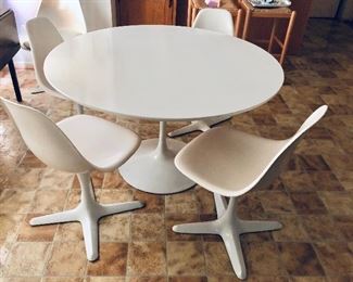 $600 - Vintage Burke tulip table and 4 chairs:  28.5" H, 48" diam.  5 chairs: each 32" H, 17" W, 20" D, seat height 18". 