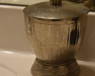 small silver bathroom canister