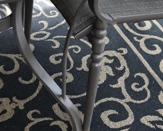 table and chair detail, outdoor rug