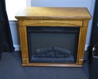 electric fireplace in wood casing
