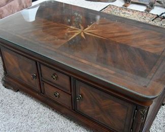 coffee table with custom glass top, top lifts to "dinner position", storage (view: as seen sitting on the sofa)