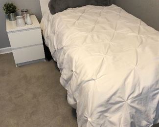 White twin headboard, mattress and nightstand