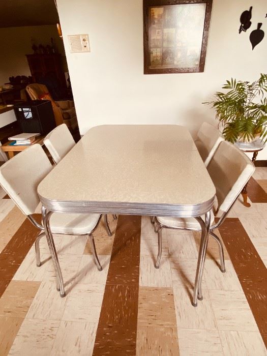 Mid Century Chrome Dinette Set with four chairs and a leaf