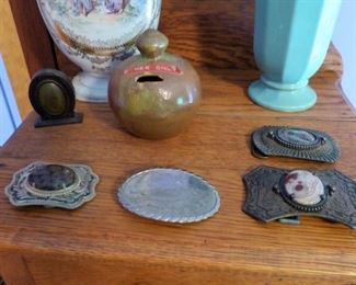 Early belt buckles and Cole pottery bank