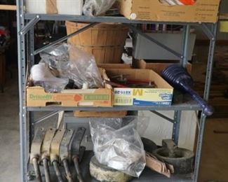 Misc shop supplies, Land Pride mower parts, and shelf