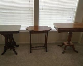 from left to right marble top side table 24 in length 18 in width 28 in tall, Side table wood with hidden drawer 28 in length,16 in width, 20 in tall, Game table open top 31 in tall18 in deep 36 in long