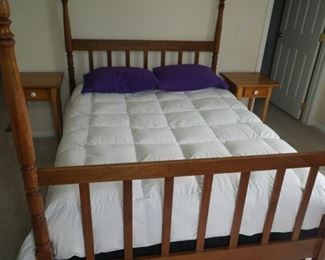 4 poster bed and bedding,  as well as  nightstands