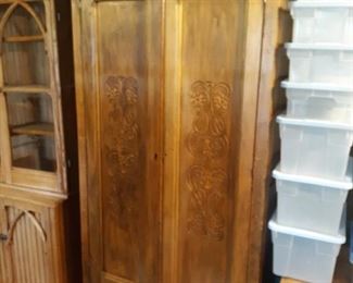 Antique wardrobe with carved doors 81 in tall 36 in width