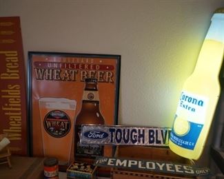 Beer advertising including a Corona lighted 2-foot plastic bottle as well as vintage For employees only sign