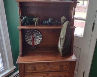 Victorian walnut cabinet; stone carvings on display