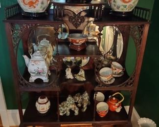 Asian rosewood etagere; porcelain; cast iron foo dogs